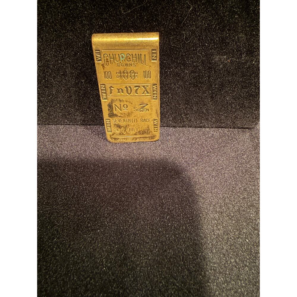 Vintage Churchill Downs brass money clip of a betting ticket